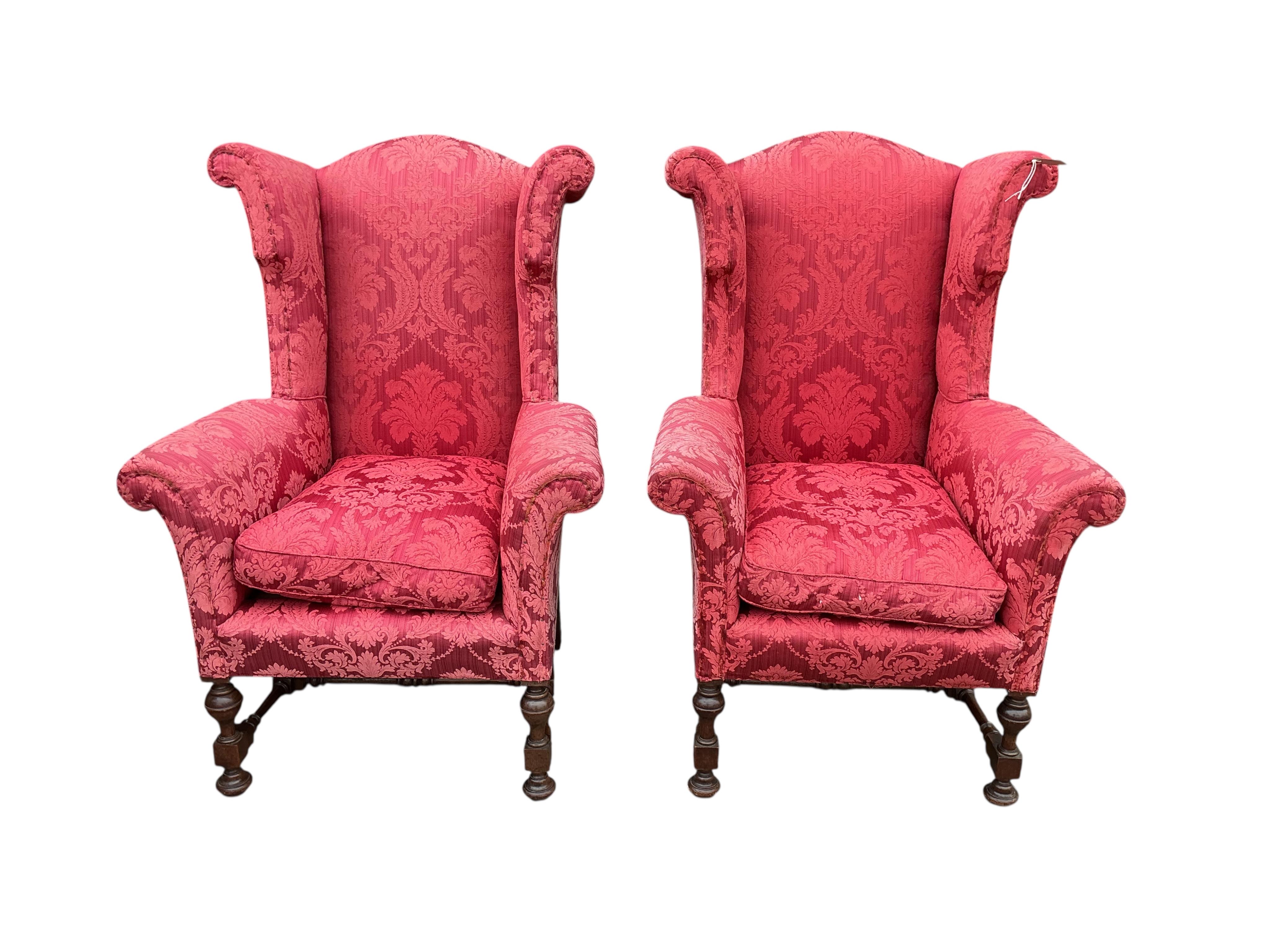 A pair of early 20th century Jacobean Revival upholstered wing armchairs, width 81cm, depth 75cm, height 127cm